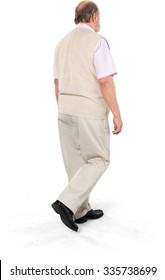 Serious Caucasian Elderly Man With Short Grey Hair In Casual Outfit Walking - Isolated