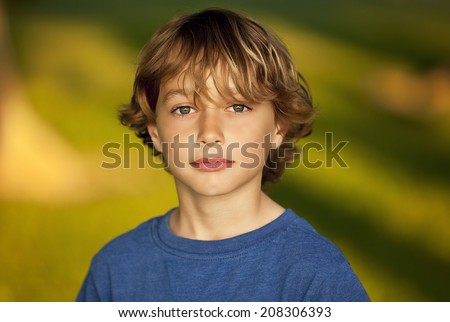 Similar – Image, Stock Photo Brown-haired boy with an athletic physique on an athletic oval massages his muscles with a foam roller for better recovery. Post-workout