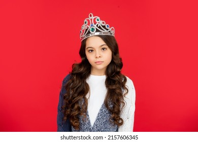 Serious Child In Queen Crown. Expressing Smug. Arrogant Princess In Tiara. Portrait Of Proud Kid.