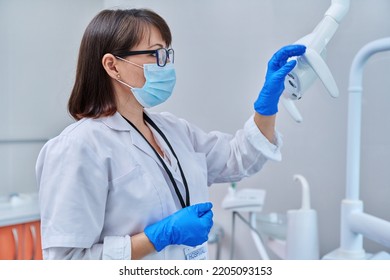 Serious Confident Female Doctor Dentist In Face Mask In Dental Office