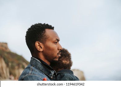 Serious Dad With His Son Outdoors