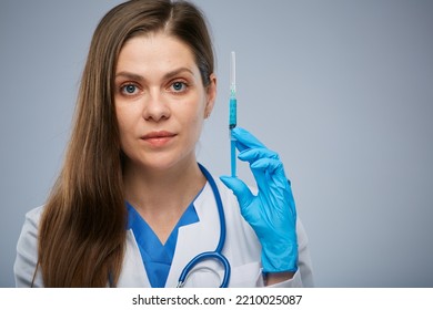 Serious Doctor Holding Syringe With Vaccine. Isolated Female Medical Worker Portrait.