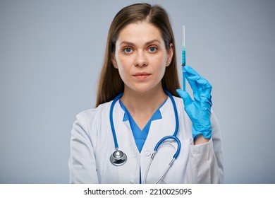 Serious Doctor Holding Syringe With Vaccine. Isolated Female Medical Worker Portrait.