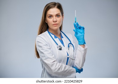 Serious Doctor Holding Syringe With Vaccine. Isolated Female Medical Worker Portrait.