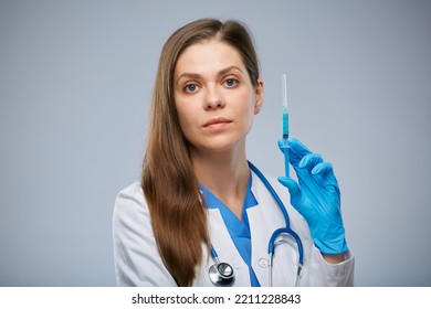 Serious Doctor Holding Syringe With Vaccine. Isolated Female Medical Worker Portrait.