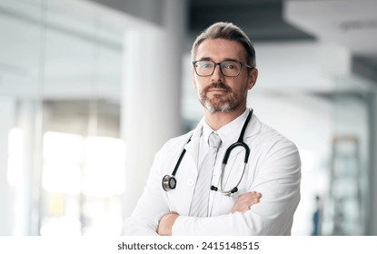 Serious doctor, portrait and man with arms crossed in hospital for healthcare, wellness or career. Face, medical professional and confident surgeon, expert and mature employee in glasses in Canada - Powered by Shutterstock