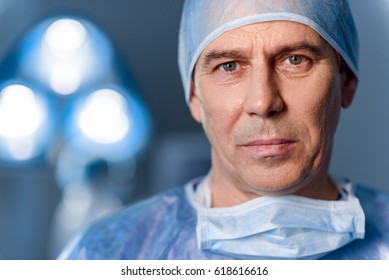 Serious Doctor Standing In Operating Room