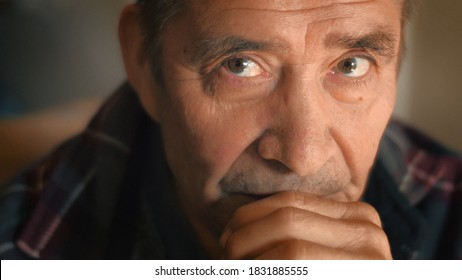 Serious Elderly Man Thinking, Looking At Camera, Closeup. Shallow DOF