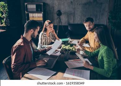 Serious experienced businesspeople wearing casual formal-wear discussing preparing law case contract tender assignment agreement at modern industrial loft brick style interior work place station
