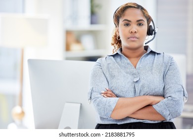 Serious Female Customer Service Worker With Headphones At The Office At A Call Center. Portrait Of An IT Tech Support Agent Dedicated To Helping Customers. Closeup Of A Woman Standing At A Desk