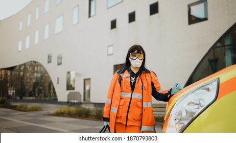 Serious Female Paramedic Looks At You. Writing On Clothes Means Urgent Care