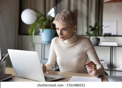 Serious Focused Businesswoman Working On Research Sit At Desk Use Laptop Read E-mail Working In Office. Lawyer Prepare Legal Agreement For Client, Secretary Organize Work Having Busy Workday Concept