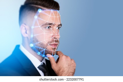 Serious handsome businessman touching chin with facial recognition by digital interface with line connection hologram. Concept of modern technology of artificial intelligence biometric scanning - Powered by Shutterstock