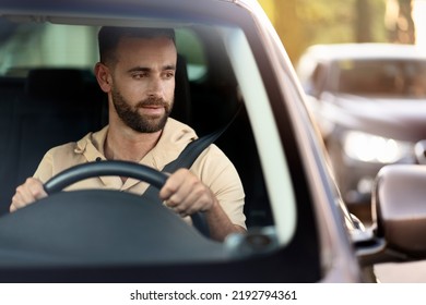 Serious Handsome Hispanic Business Man Driving A Car, Copy Space. Sad Latin Driver Stuck In Traffic 