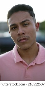 A Serious Hispanic Man Portrait Looking At Camera. A Latin South American Person