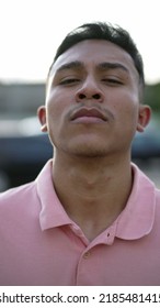 A Serious Hispanic Man Portrait Looking At Camera. A Latin South American Person