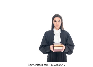 Serious Judge In Judicial Robe Holding Books Isolated On White