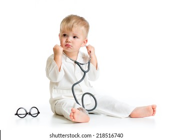 serious kid playing doctor with stethoscope isolated
