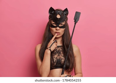 Serious Lady Vamp Wears Bdsm Outfit, Poses With Whip, Enjoys Physical Restrains During Sex, Unequal Power Relationships Including Bondage, Discipline, Dominance, Submission And Sadomasochism