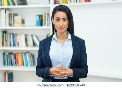 Serious Latin American Mature Businesswoman With Blazer At Office Of Company