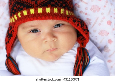 Serious Latin Baby Boy In Warm Hat - Peruvian Chullo