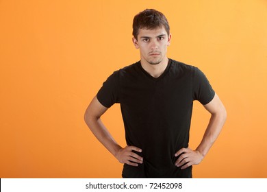 Serious Latino Teen With His Hands On Hips