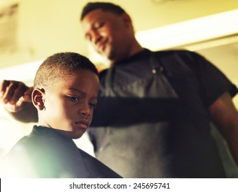 Serious Little Boy In Barber Shop