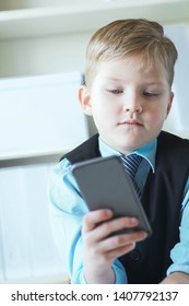 Serious Little Boy Looking Phone Fathers Stock Photo 1407792137 ...