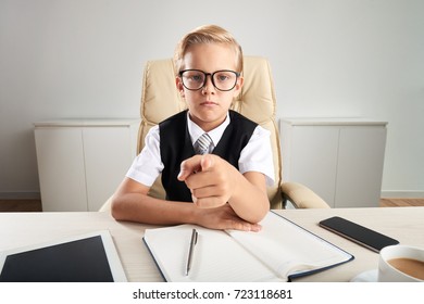 Serious Little Business Entrepreneur Pointing At You With Finger