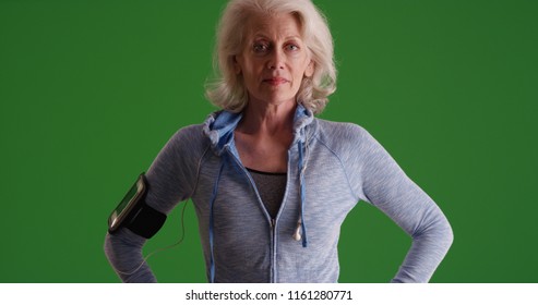 Serious Looking Old White Woman Posing In Sportswear On Green Scree