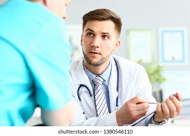 Serious Male Doctor Asking Colleague For Advice About Difficult Medical Case Trying To Resolve It Portrait