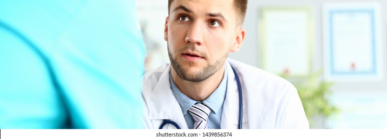 Serious Male Doctor Asking Colleague For Advice About Difficult Medical Case Trying To Resolve It Portrait