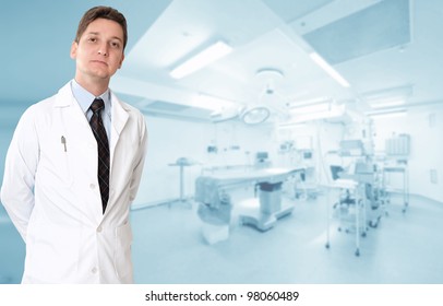 Serious male doctor with an operating room at the background