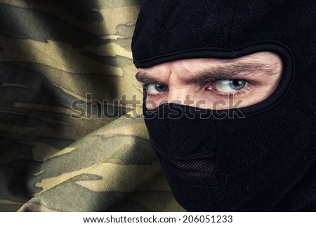 Serious man in a balaclava mask