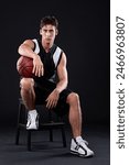 Serious, man and basketball player in portrait on chair for sports photography and professional draft. Fitness, male perosn and athlete sitting for selection, team trials and talent squad option