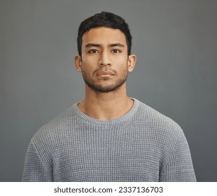 Serious man, casual style and portrait with modern fashion in a studio. Male model, grey background and young person from Philippines of a handsome Asian adult with confidence, attitude and jersey - Shutterstock ID 2337136703