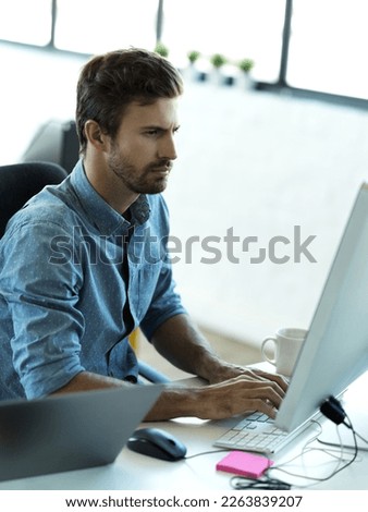 Serious man, computer typing and web business planning a website layout in office. Content management, startup and employee on technology working on creative strategy design with tech software