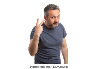 Serious Man Holding Two Fingers Up As Counting Concept Isolated On White Studio Background