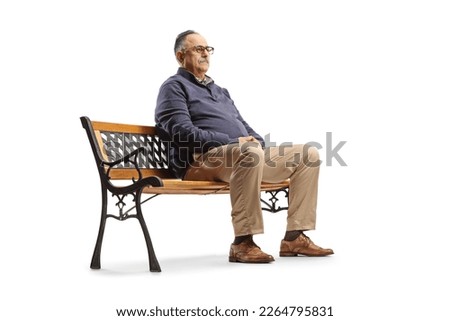 Serious mature man sitting on a bench and thinking isolated on white background