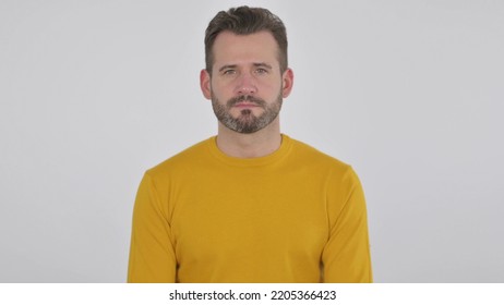 Serious Middle Aged Man Looking At The Camera , White Background