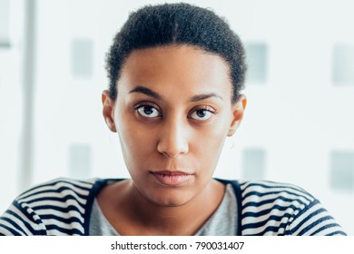 Serious Mixed Race Woman Looking At Camera