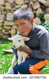 Serious Native American Child With A Sheep.