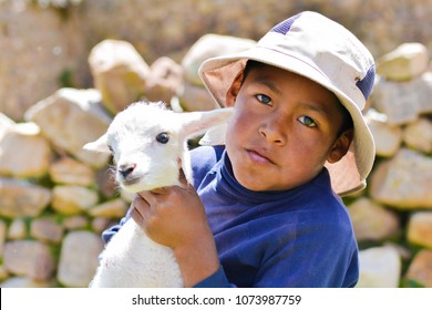 Serious Native American Child With A Sheep.