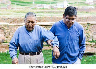 Serious Native American Elderly Father And Son In The Countryside.