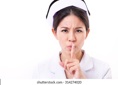 serious nurse asking for silence with hand gesture