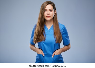 Serious Nurse Woman In Blue Medical Uniform. Isolated Female Portrait.