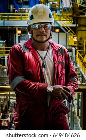 A Serious Offshore Oil Rig Worker In Red Coverall