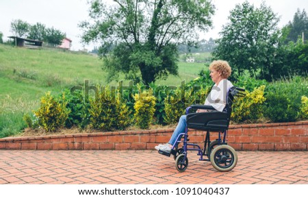 Similar – Granddaughter hugging grandmother in wheelchair