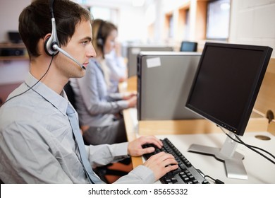 Serious Operator Using A Computer In A Call Center