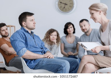 Serious Patient Looking At His Therapist During An Anger Management Class